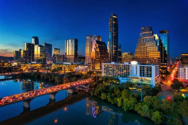 Austin skyline at dusk with downtown buildings lit up